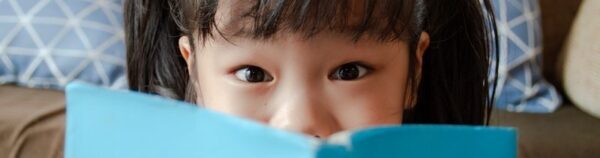 portrait-little-girl-looking-camera-600x158